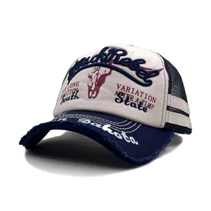 Close-up of distressed vintage mesh cap with JackRebel embroidery and navy brim
