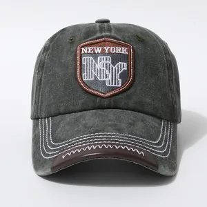 Detailed embroidery on vintage washed grey baseball cap with New York patch and leather brim