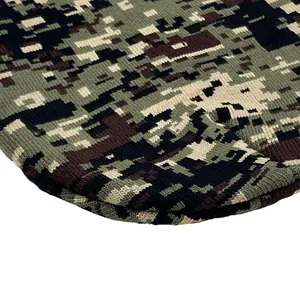 Winter knit beanie hat featuring digital camouflage jacquard pattern in olive and brown