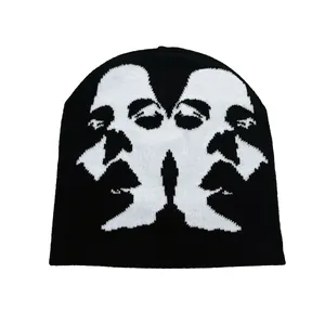 Unisex black beanie with white jacquard face sketch pattern for street fashion style