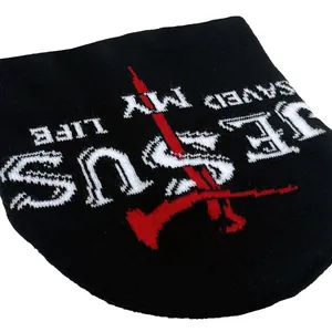 Black knit beanie with Jesus Saved My Life jacquard and red cross on white background