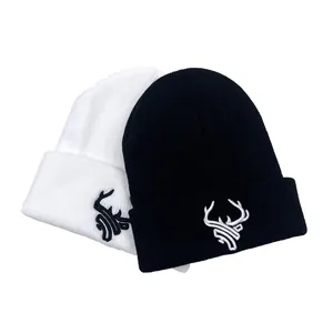 Winter knit beanies with 3D deer embroidery in black and white styles for cold weather