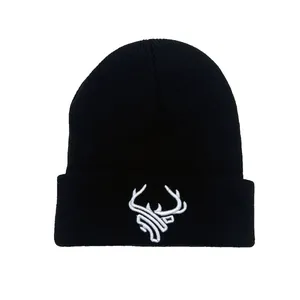 Black knit beanie with white deer head embroidery and folded cuff for winter