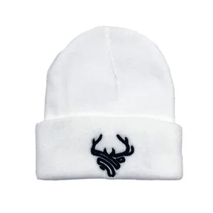 White winter knit beanie with black 3D deer embroidery and classic fold-over cuff