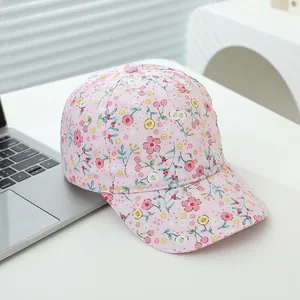 Pink floral print cotton baseball cap for kids with a curved brim and sun protection design