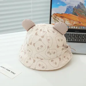 Detail of baby sun hat featuring cute panda print, 3D ears and delicate bow decoration