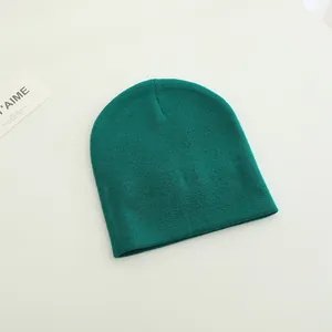 Kids cute dark green knitted dinosaur beanie hat with a minimalist cozy design