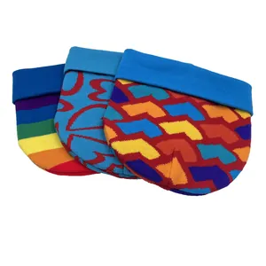 Detailed knit pattern on winter beanies with rainbow stripes and colorful geometric designs