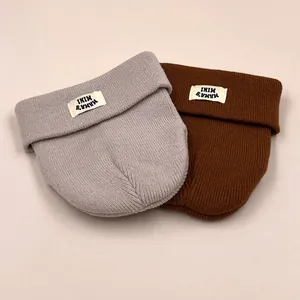 Two-pack of kids MAMA'S MINI knitted beanies in grey and caramel colors with folded brim
