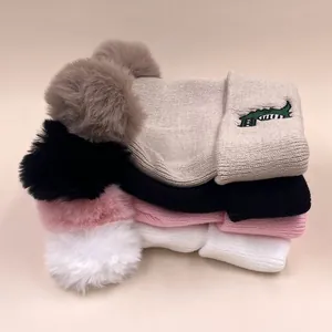 Winter knit beanies for toddlers with cute crocodile embroidery and faux fur pom-poms