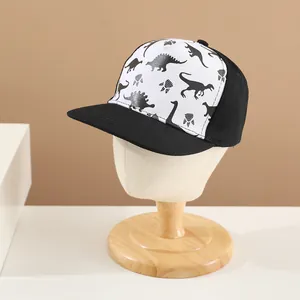 Kids baseball cap with black and white color block design and dinosaur silhouettes