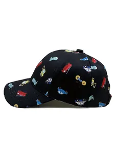 Close-up of black kids baseball cap with colorful cartoon vehicle patterns and stitching