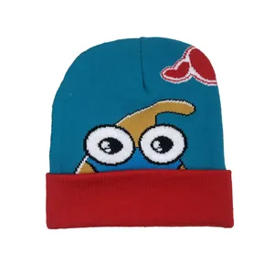 Winter knitted beanie with cartoon fox eye pattern and heart detail in blue and red