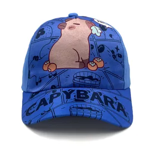 Close-up of blue Capybara baseball cap showing the cartoon print and wide brim details