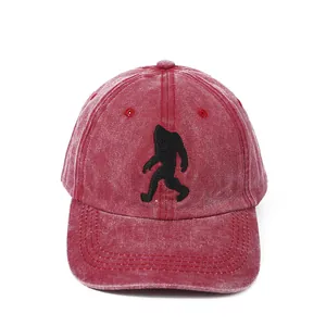 Washed reddish cotton baseball cap with black embroidered Bigfoot silhouette pattern