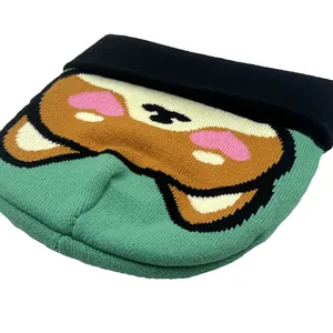 Winter knitted beanie with fox eyes jacquard pattern in black and mint green color