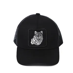 Black trucker hat with wolf embroidery patch and breathable mesh back for outdoors
