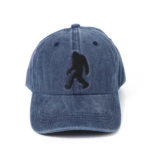 Close-up of black gorilla embroidery on retro washed blue denim baseball cap detail