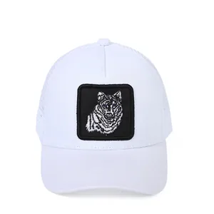 White trucker hat with wolf embroidery patch and breathable mesh back for summer