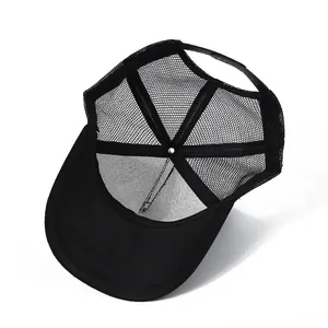 Interior view of black mesh trucker hat showing breathable panels and sweatband