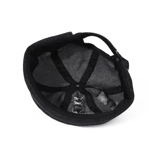 Distressed black denim docker hat showing interior stitching and washed street style details