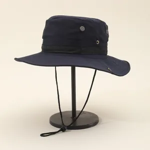Detail of outdoor sun hat featuring metal ventilation eyelets and adjustable windproof cord