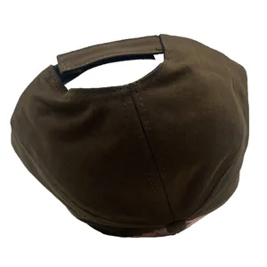 Detail of adjustable velcro strap on dark brown Capybara baseball cap for kids