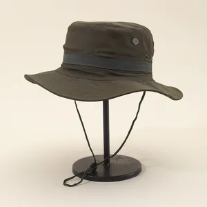 Detail of outdoor sun hat featuring gray webbing trim and side ventilation eyelets