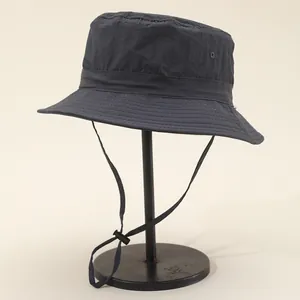 Detail of waterproof quick-dry bucket hat featuring mesh vents and adjustable wind cord