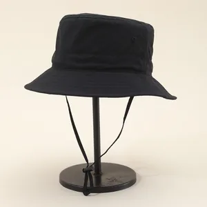Waterproof outdoor bucket hat in black with adjustable windproof drawstring for hiking