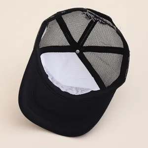 Close-up of trucker hat interior with breathable mesh and white NY embroidery on the back