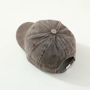 Vintage brown washed cotton baseball cap with train embroidery and adjustable metal buckle