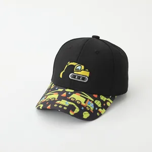 Detailed view of yellow excavator embroidery on black kids baseball cap with printed brim