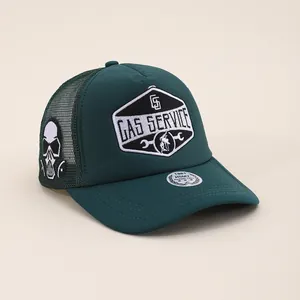 Detailed embroidery on green mesh trucker hat featuring Gas Service patch and skull detail