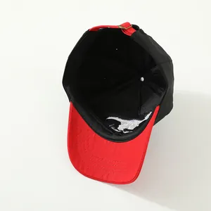Kids baseball cap featuring red and black contrast colors and embroidered horse logo