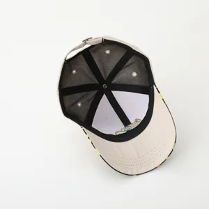 Detail view of the beige kids baseball cap interior showing stitching and adjustable buckle