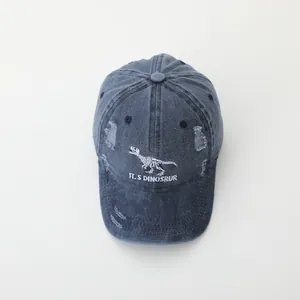 Vintage washed navy blue baseball cap with dinosaur skeleton embroidery and distressed details