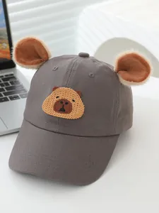 Detail of grey baseball cap with 3D plush ears and cute capybara embroidery on canvas