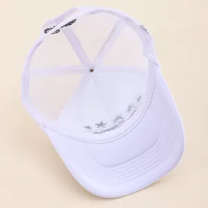 Detailed top view of white mesh trucker hat showing breathable mesh and LOVED embroidery