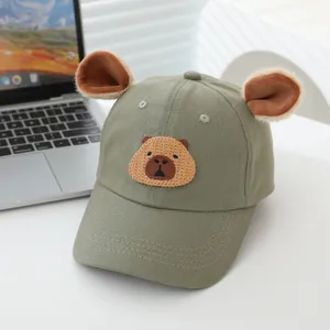 Detailed embroidery of brown cartoon bear and plush ears on light green canvas baseball cap
