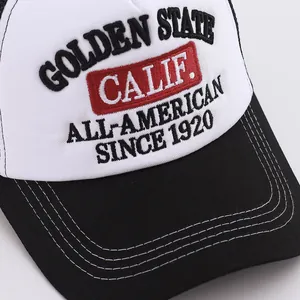 Macro shot of high-density Golden State embroidery on a cotton mesh trucker baseball cap