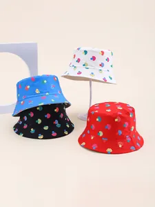 Detailed view of four colorful mushroom print bucket hats in white, blue, black, and red