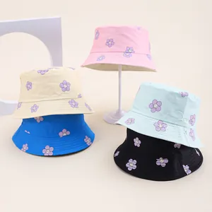 Kids cotton bucket hats with smiling purple flower patterns in five colorful options