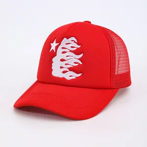 Red mesh trucker hat featuring white flame and star embroidery with a curved brim