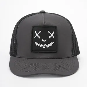 Dark grey trucker hat with face embroidery and black breathable mesh back panel