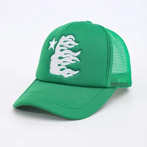 Detail view of bright green trucker hat featuring white flame and star embroidery