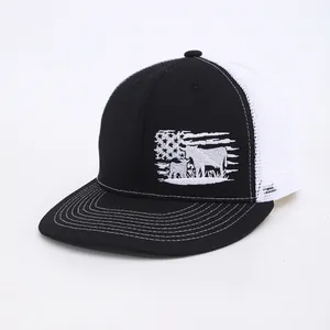 Black and white mesh trucker hat featuring a cow silhouette and USA flag embroidery