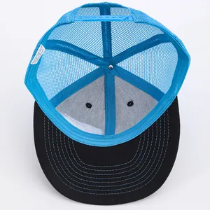 Blue mesh trucker hat with black brim and adjustable snapback shown from an inside view