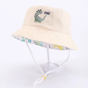 Cappello da sole beige per bambini con ricamo a dinosauro e tesa stampata su base