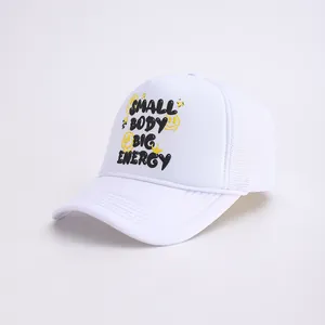 Close-up of white trucker hat with yellow smiley face and small body big energy text